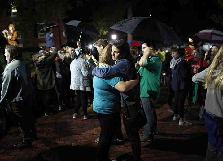 After sharing her story of sexual assault, Briana Sivy, a junior from Columbus, right, hugs Kaleigh Scott, a sophomore from Grove City, following a rally for Ohio University students to raise awareness of sexual assault on campus on the school's College Green on Sept. 27, 2018. Sivy told the crowd of nearly 1,000 students about how she is attempting to turn her assault into a positive message for others on campus.  (Adam Cairns / The Columbus Dispatch)